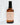 Eine braune Flasche MERME Berlin FACIAL RELAXING MIST – 100 % Organic Lavender Water Packs steht auf einer weißen Oberfläche mit sauberem Hintergrund und spendet Feuchtigkeit und Antioxidantien für erfrischte Haut.